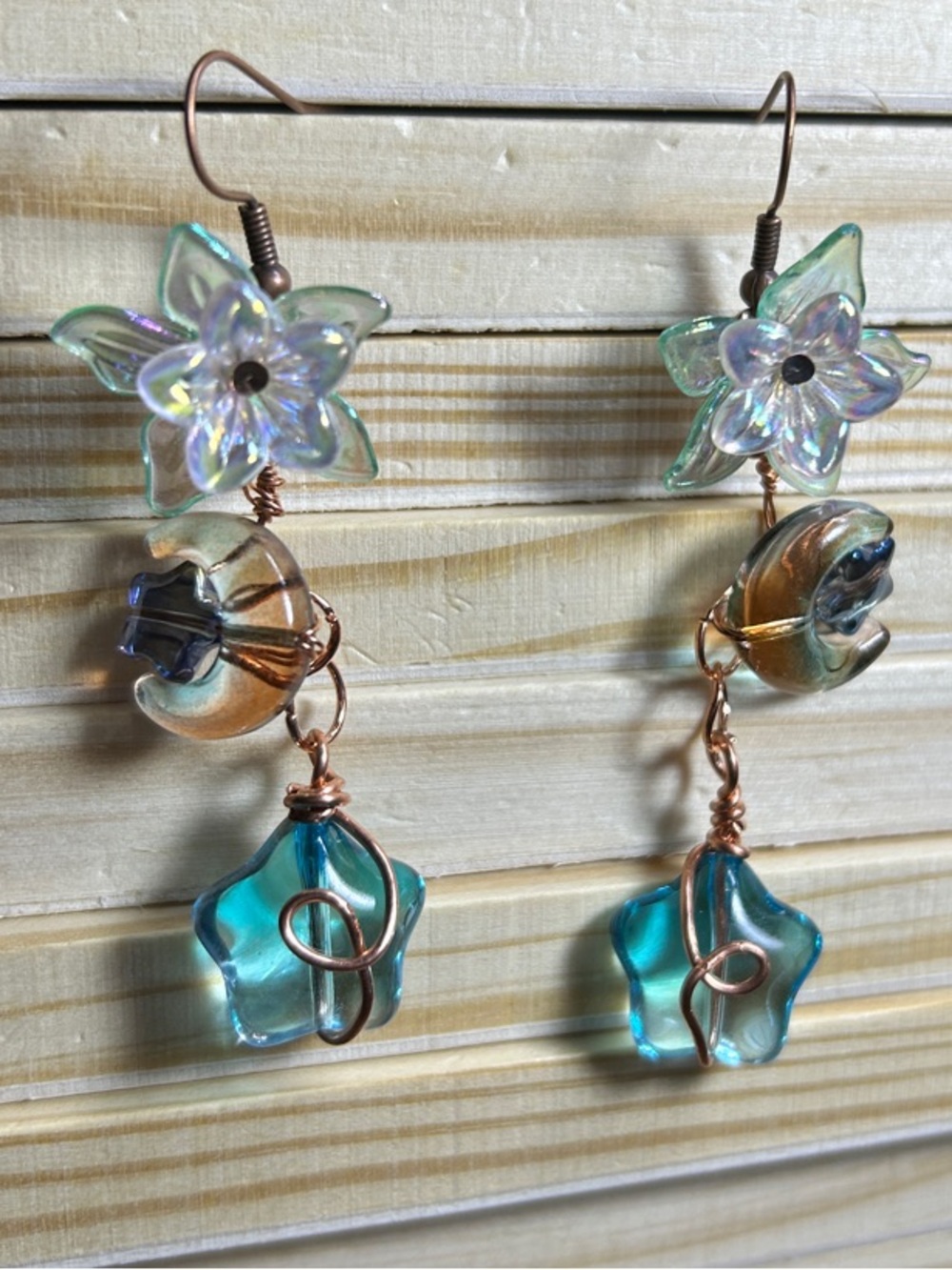 3/$25 Iridescent Flower Drop Earrings in Blue and Gold